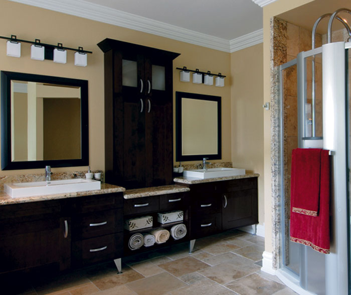 Espresso shaker cabinets in contemporary bathroom by Kitchen Craft Cabinetry