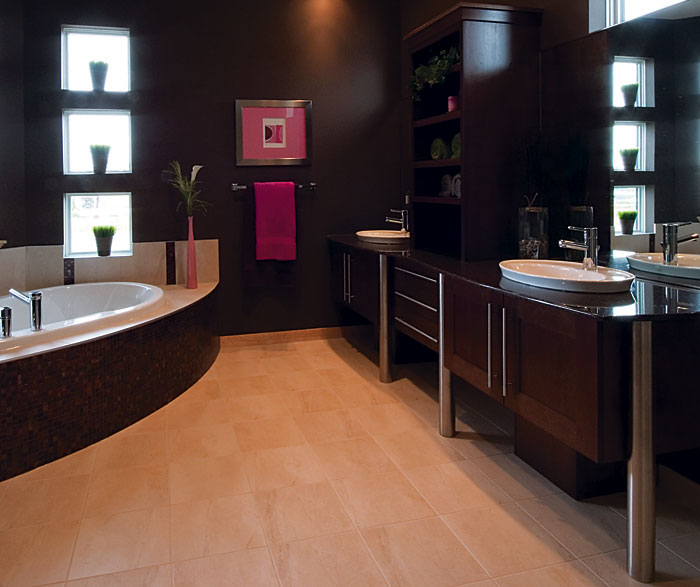 Contemporary bathroom cabinets in dark maple finish by Kitchen Craft Cabinetry